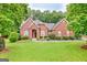 Beautiful brick home with well-manicured lawn and mature trees at 835 Virginia Parks, Fayetteville, GA 30215