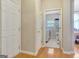 Hallway view leading to a laundry room with white appliances at 835 Virginia Parks, Fayetteville, GA 30215