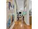 Inviting hallway with hardwood floors leading to a bright living space with a fireplace at 835 Virginia Parks, Fayetteville, GA 30215
