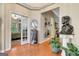 Hallway leading to bedroom, featuring hardwood floors and decorative accents at 835 Virginia Parks, Fayetteville, GA 30215