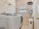 Convenient laundry room with modern appliances and storage shelving at 835 Virginia Parks, Fayetteville, GA 30215