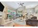 Bright living room with vaulted ceilings, large windows, and cozy seating arrangement at 835 Virginia Parks, Fayetteville, GA 30215