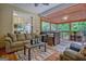 Relaxing screened porch with comfortable furniture and view of wooded area at 835 Virginia Parks, Fayetteville, GA 30215