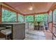 Charming screened porch with dining and bar seating at 835 Virginia Parks, Fayetteville, GA 30215