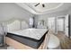 Comfortable bedroom showcasing hardwood flooring, a decorative tray ceiling, and furniture at 1535 Fenmore St, Lithia Springs, GA 30122