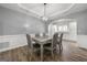 Formal dining room with elegant chandelier and access to kitchen and other living areas at 1535 Fenmore St, Lithia Springs, GA 30122