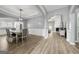 Dining area features hardwood flooring, wainscoting, modern lighting and seamless access to living spaces at 1535 Fenmore St, Lithia Springs, GA 30122