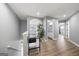 Upstairs hallway with wood floors, with view of half bath and living area below at 1535 Fenmore St, Lithia Springs, GA 30122