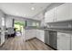Kitchen featuring granite countertops, stainless steel appliances, and a view to the backyard at 1535 Fenmore St, Lithia Springs, GA 30122
