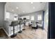 Kitchen and dining area with bar stool seating, modern appliances, and access to the backyard at 1535 Fenmore St, Lithia Springs, GA 30122