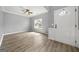 Open-concept living area showcasing hardwood floors, a ceiling fan, and neutral wall color at 1535 Fenmore St, Lithia Springs, GA 30122