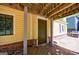 A side view of basement access, window, and grill, on a gravel and grassy yard at 381 Cherokee Se Ave, Atlanta, GA 30312