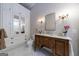 Elegant bathroom with a vintage vanity, marble countertop and storage at 381 Cherokee Se Ave, Atlanta, GA 30312