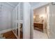 Hallway view of a bathroom with white herringbone tile flooring at 381 Cherokee Se Ave, Atlanta, GA 30312