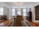 Classic dining room with hardwood floors, a crystal chandelier, and large windows offering lots of natural light at 381 Cherokee Se Ave, Atlanta, GA 30312