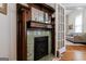 Decorative tiled fireplace with a wooden mantelpiece and mirror adding character to this vintage home at 381 Cherokee Se Ave, Atlanta, GA 30312