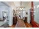 Welcoming foyer with hardwood floors, a vintage rug, and detailed woodwork at 381 Cherokee Se Ave, Atlanta, GA 30312