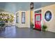 Spacious front porch with a red door, stained glass accents, and vintage charm at 381 Cherokee Se Ave, Atlanta, GA 30312
