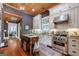 Modern kitchen with stainless steel appliances, custom cabinetry, and a butcher block island for food preparation at 381 Cherokee Se Ave, Atlanta, GA 30312