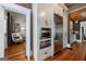 Bright kitchen with stainless steel appliances, white cabinets, and hardwood flooring at 381 Cherokee Se Ave, Atlanta, GA 30312