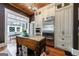 Spacious kitchen with stainless steel appliances, custom cabinets, and a butcher block island for culinary enthusiasts at 381 Cherokee Se Ave, Atlanta, GA 30312