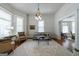 Bright living room with large windows, hardwood floors, and a comfortable seating area at 381 Cherokee Se Ave, Atlanta, GA 30312