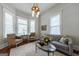 Bright and airy living room featuring a comfortable sofa, classic details, and natural light at 381 Cherokee Se Ave, Atlanta, GA 30312