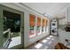 Bright sunroom with large windows, natural shades, and laundry area at 381 Cherokee Se Ave, Atlanta, GA 30312