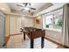 Finished basement featuring a recreation area with foosball table, a ceiling fan, and closet storage at 151 Overhill Point, Alpharetta, GA 30005