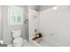 Bathroom featuring a toilet, a bathtub and shower combo, and a shuttered window at 151 Overhill Point, Alpharetta, GA 30005
