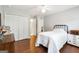 A cozy bedroom featuring a full bed, a closet, and an ensuite bath at 151 Overhill Point, Alpharetta, GA 30005