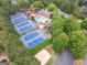 Aerial shot of community pool and tennis courts surrounded by mature trees at 151 Overhill Point, Alpharetta, GA 30005