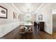 Spacious dining room featuring hardwood floors, a chandelier, and detailed trim at 151 Overhill Point, Alpharetta, GA 30005