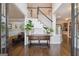 Grand foyer with hardwood floors, a staircase, and decorative console table at 151 Overhill Point, Alpharetta, GA 30005