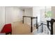 Bright hallway with black and white accents, a chandelier, and access to stairs at 151 Overhill Point, Alpharetta, GA 30005