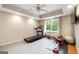 Bright home gym with exercise equipment, rubberized flooring, and a window for natural light at 151 Overhill Point, Alpharetta, GA 30005