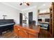 Spacious office with hardwood floors, a built-in bookcase, and a classic piano at 151 Overhill Point, Alpharetta, GA 30005