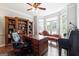 Bright office featuring hardwood floors, a bay window, and built-in bookshelves at 151 Overhill Point, Alpharetta, GA 30005