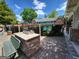 Community area with outdoor cooking spaces, a grill, and a bench overlooking the pool at 151 Overhill Point, Alpharetta, GA 30005