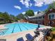 Community pool featuring lap lanes and deck chairs for relaxing in the sun on a beautiful summer day at 151 Overhill Point, Alpharetta, GA 30005