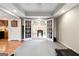Recreation room with double doors leading to a foosball table and gray padded flooring at 151 Overhill Point, Alpharetta, GA 30005
