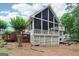 Back of house featuring a screened porch and a beautiful outdoor living space at 151 Overhill Point, Alpharetta, GA 30005