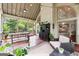 Inviting screened porch with dining and seating areas, ideal for enjoying the outdoors at 151 Overhill Point, Alpharetta, GA 30005