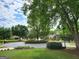 Beautifully landscaped cul-de-sac, featuring mature trees and well-maintained lawns at 151 Overhill Point, Alpharetta, GA 30005