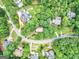 Aerial view of the neighborhood showcasing mature trees, winding roads, and well-maintained properties at 164 Interlochen Dr, Peachtree City, GA 30269