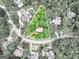 Aerial view of a wooded property on a cul-de-sac, showcasing the natural landscape and surrounding neighborhood at 164 Interlochen Dr, Peachtree City, GA 30269