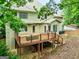This home features a private backyard with a spacious wooden deck and an exterior side entrance at 164 Interlochen Dr, Peachtree City, GA 30269