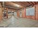 Unfinished basement with exposed beams, utilities, and insulation for potential future expansion at 164 Interlochen Dr, Peachtree City, GA 30269