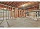 Unfinished basement with exposed wood framing and concrete floor ready for customization at 164 Interlochen Dr, Peachtree City, GA 30269