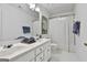 Bathroom featuring a dual sink vanity and shower with curtain at 164 Interlochen Dr, Peachtree City, GA 30269